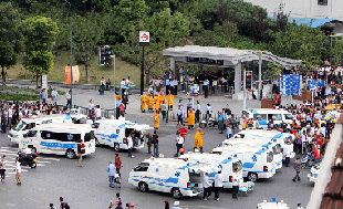 Ambulances arrive at the exit of subway line 10 after a train rear-ended another Tuesday afternoon in Shanghai. [Photo/Xinhua]